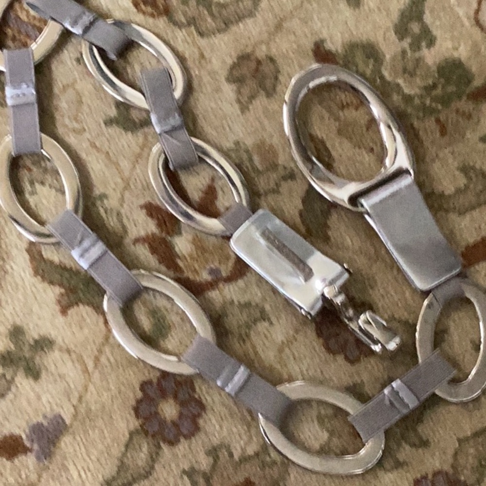 Suzi Roher grey stretch belt with silver accents and silver closure